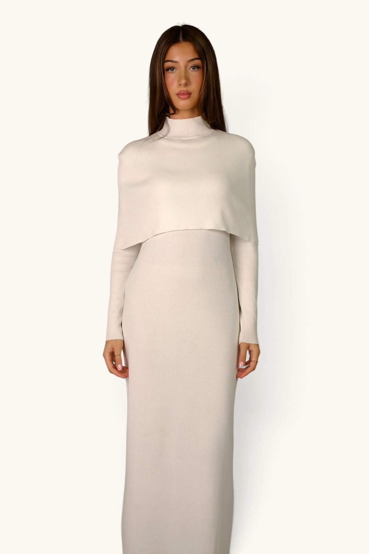 Gebreide jurk met cape-detail