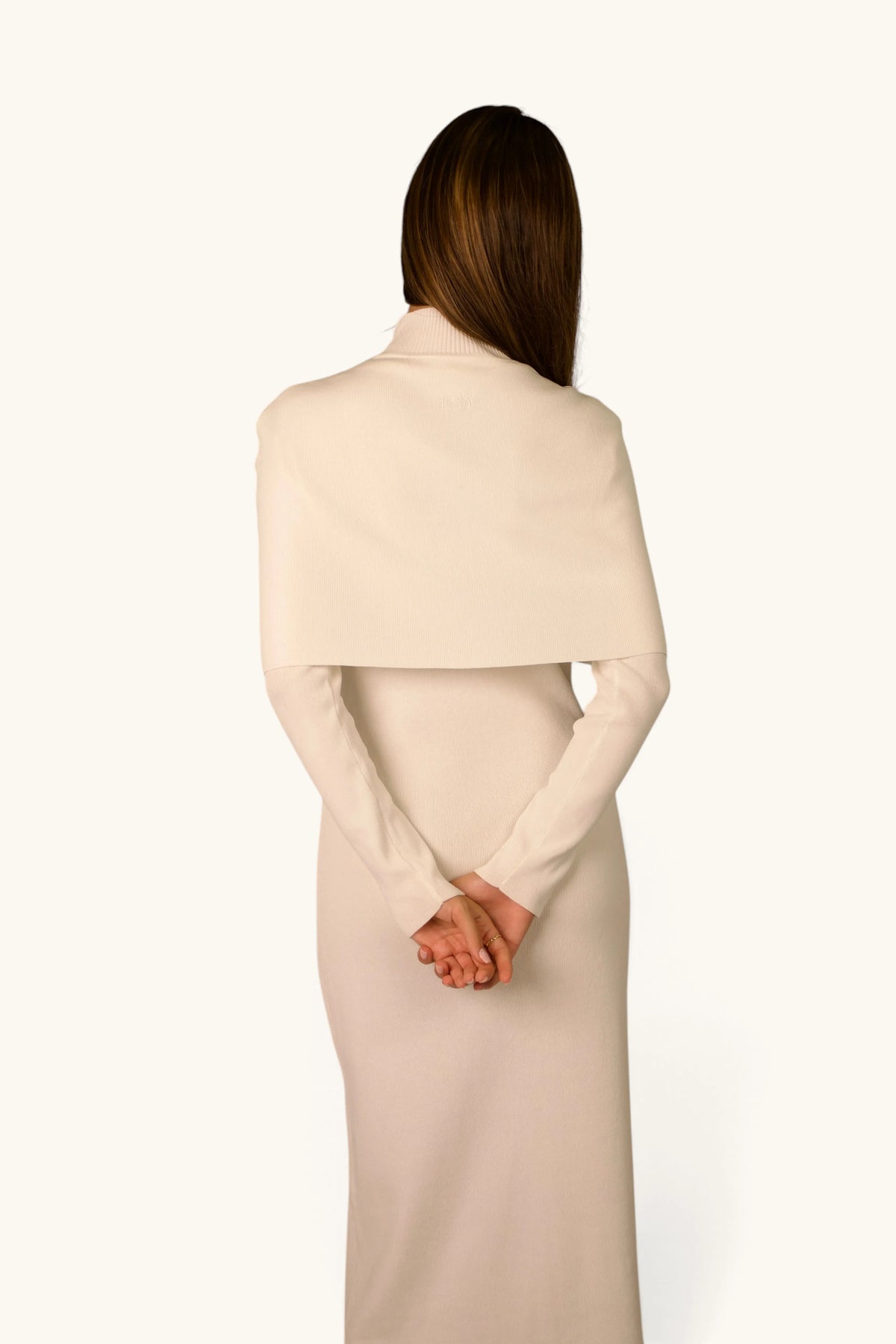 Gebreide jurk met cape-detail