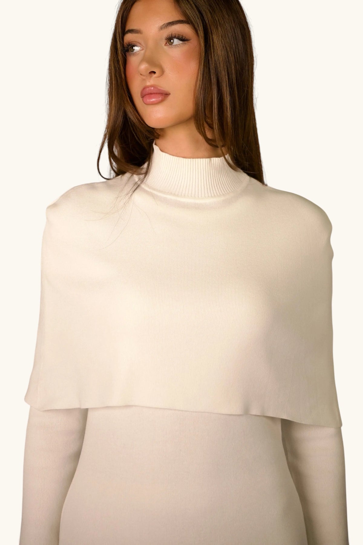 Gebreide jurk met cape-detail
